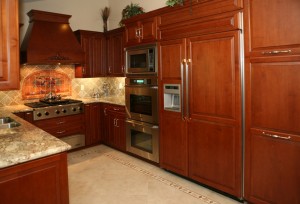 A kitchen with dark wood cabinets