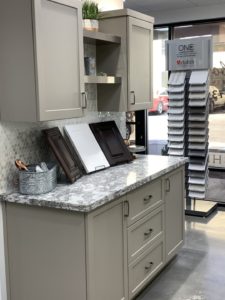 A kitchen remodeling showroom with sample cabinets displayed.