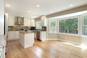 Kitchen in remodeled home with large picture window