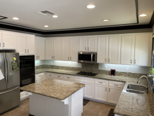 Everyday family kitchen features shaker cabinets and new countertops