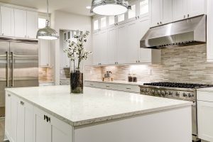 Gourmet Kitchen Features White Cabinetry and Stainless appliances