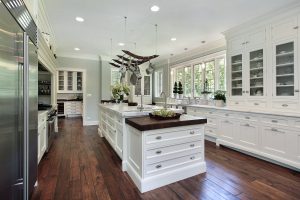Luxury kitchen with white cabinets and a large island