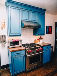 Blue kitchen cabinets in a remodeled kitchen