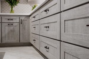 Close-up of gray kitchen cabinets.