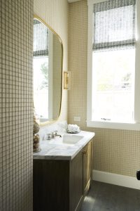 Picture of bathroom with big mirror and bathroom vanity