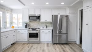 White kitchen with steel appliances